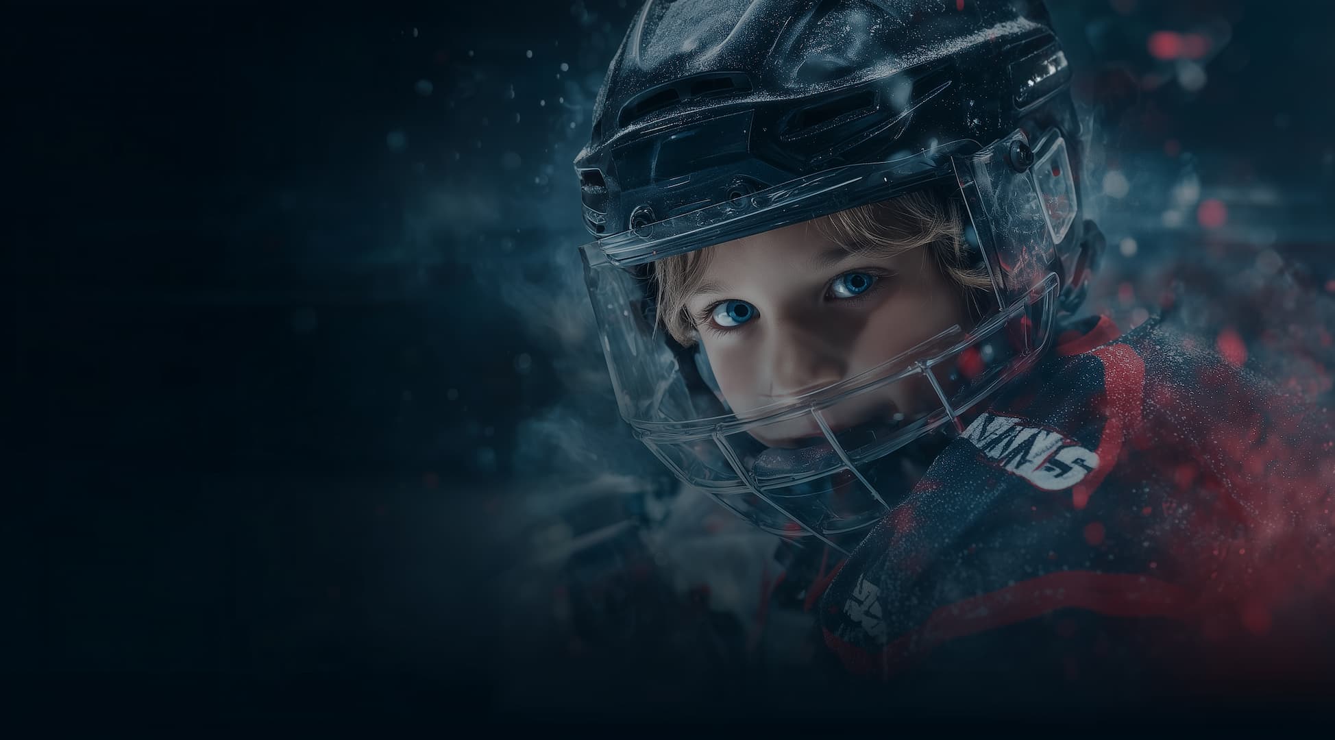Young boy in CCM helmet on the ice, intense focus